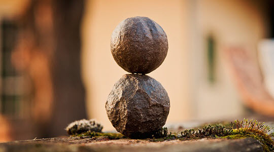 Two round stones balanced on top of each other