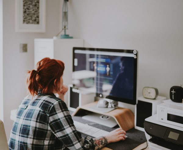 woman looking at computer screen